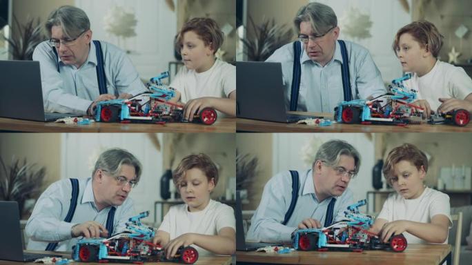 一个男孩和他的爷爷正在组装一辆玩具车