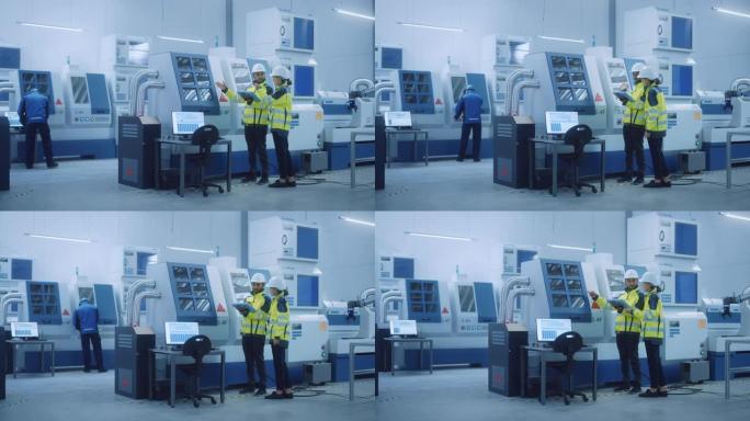 总工程师和项目经理穿着安全背心和安全帽，在工厂中使用数字平板控制器，优化数控机械，编程机器以提高生产
