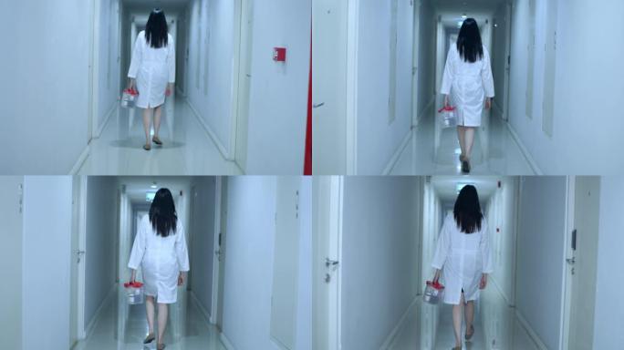 亚洲女医生走过医院走廊