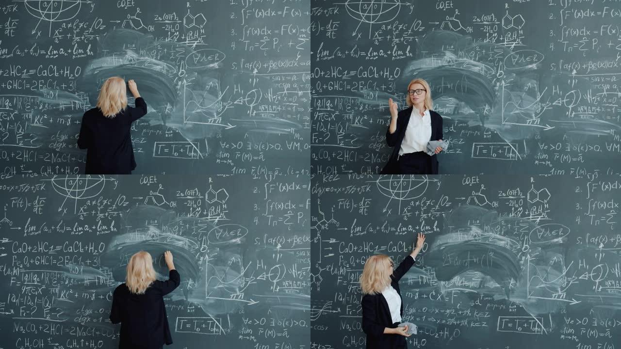 成年女老师在学校的黑板上写公式