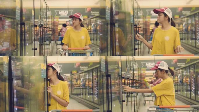 在超市买速冻食品的女人。