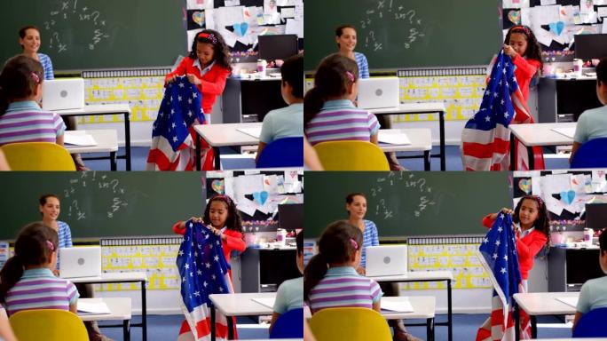 非裔美国女学生在教室里解释美国国旗的前视图4k