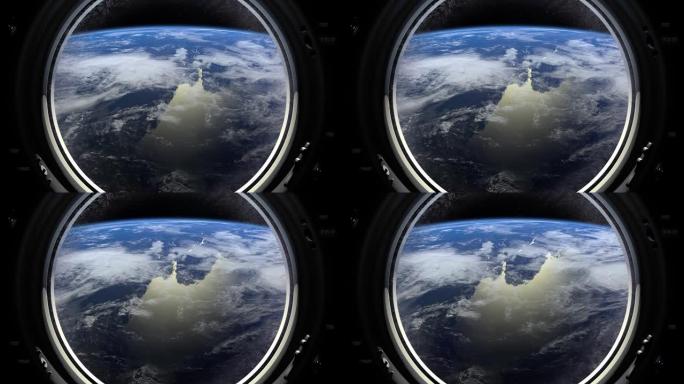 地球穿过宇宙飞船的大舷窗。国际空间站向右移动。现实的氛围。国际空间站。4K。