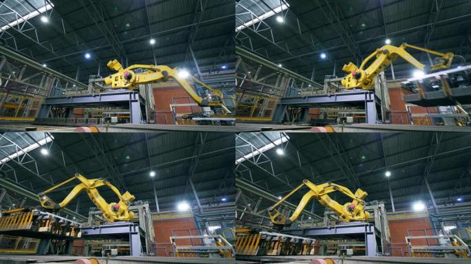 机械机械臂正在工厂搬迁砖块。