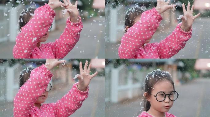 快乐可爱的小女孩在冬天玩雪