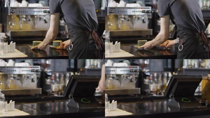 男咖啡师在咖啡店提供饮料