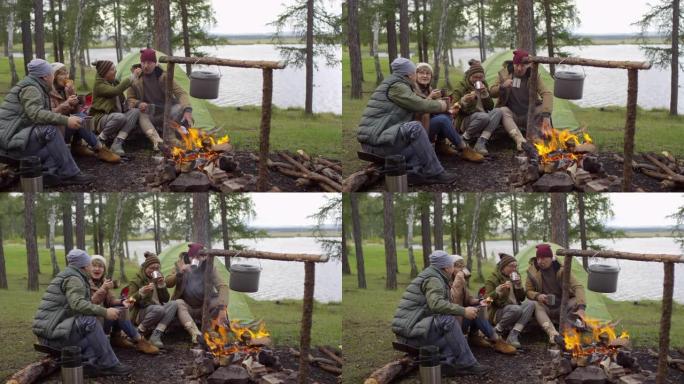 一群老年游客在篝火旁喝茶吃包子