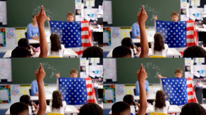 男生在教室里举手的后视图4k
