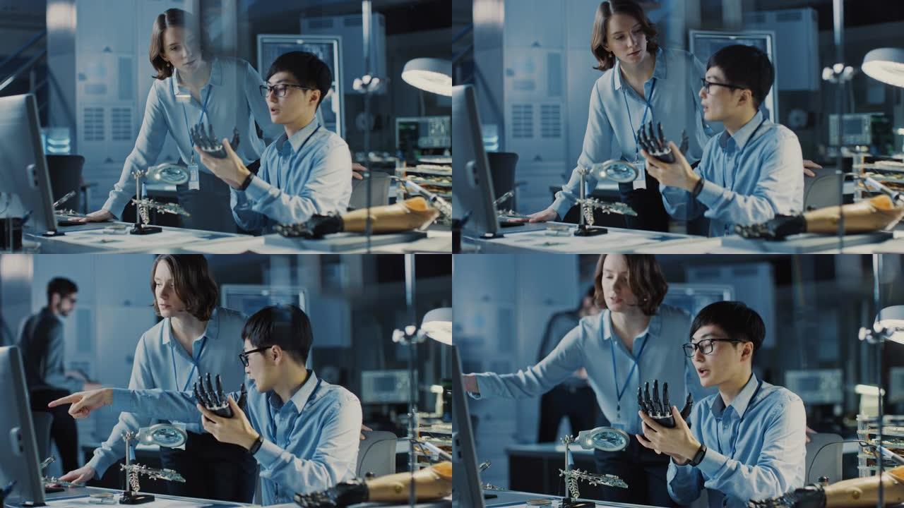 技术假肢机器人手臂由两名专业开发工程师在高科技研究实验室中使用现代未来设备进行测试。男人和女人在个人