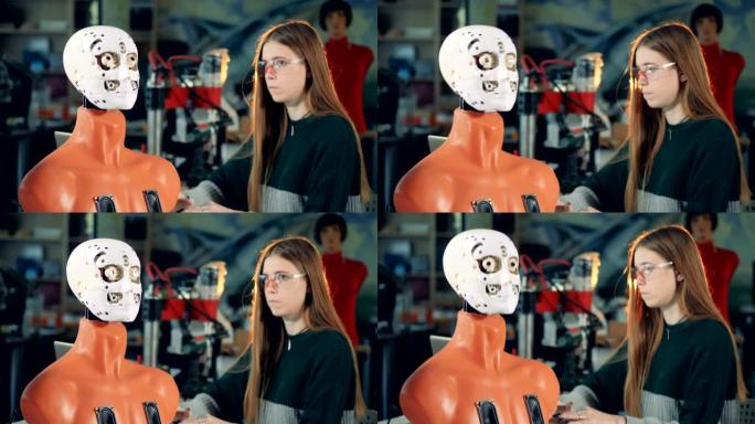 女专家正在控制一个机器人如何翻白眼