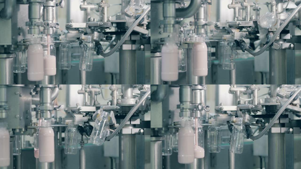食品工厂的自动化生产线。在工厂用酸奶填充瓶子的过程。
