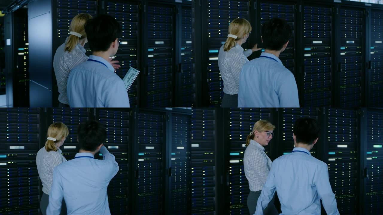 在现代数据中心: 工程师和IT专家与服务器机架一起工作，与笔记本电脑交谈，进行系统维护检查。做数据库