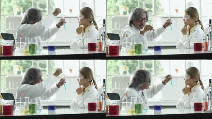 4k: 两位科学家在实验室中滴液和讨论。