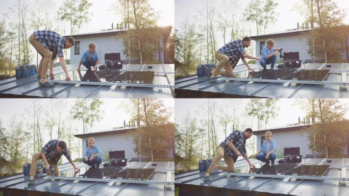 父子俩用钻头将太阳能电池板安装到金属基础上。他们在晴天和高五时在房屋屋顶上工作。家庭生态可再生能源的