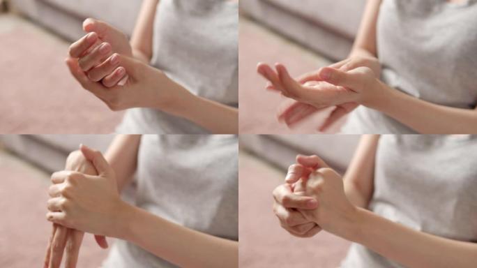 亚洲成年女性手部疼痛的4k镜头。手上按摩
