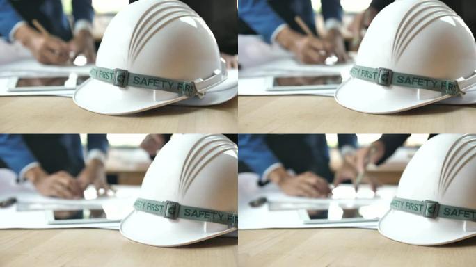 安全帽和工程师或建筑师从事背景，安全第一概念的工作