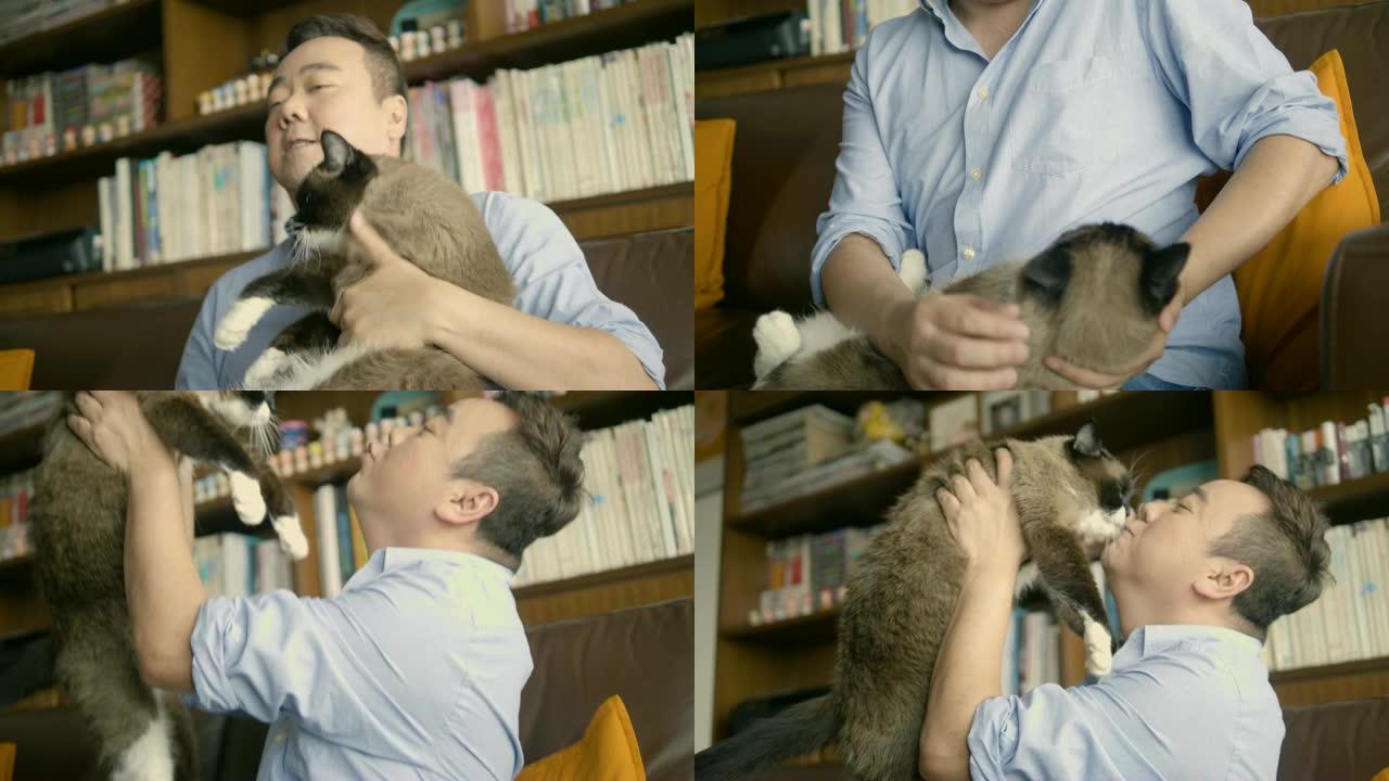 亚洲男子在家中抱着猫