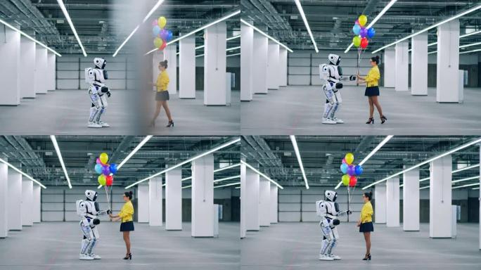 年轻女士正在给机器人送彩色气球