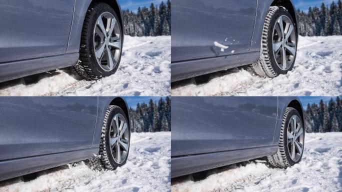 汽车轮胎在原地旋转，无处可去，被困在雪中