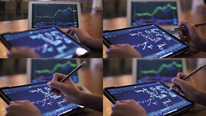 在数字平板电脑上的股票市场数据图表上的商人分析