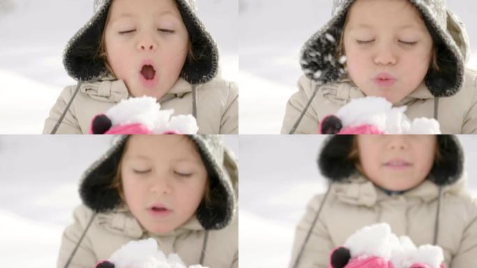 在冬天的日子里，一个美丽的女孩在山上玩耍，将雪抛向空中，看着它落下。
