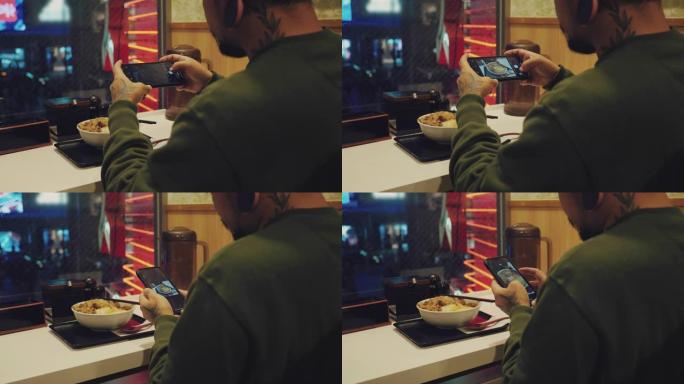亚洲男子在餐厅用手机拍照咖喱牛肉饭。