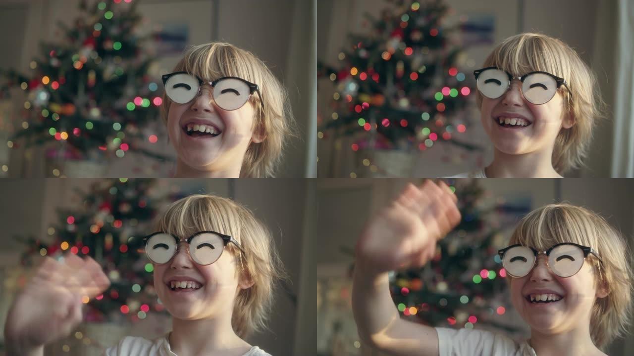 圣诞节穿着有趣眼镜的男孩。