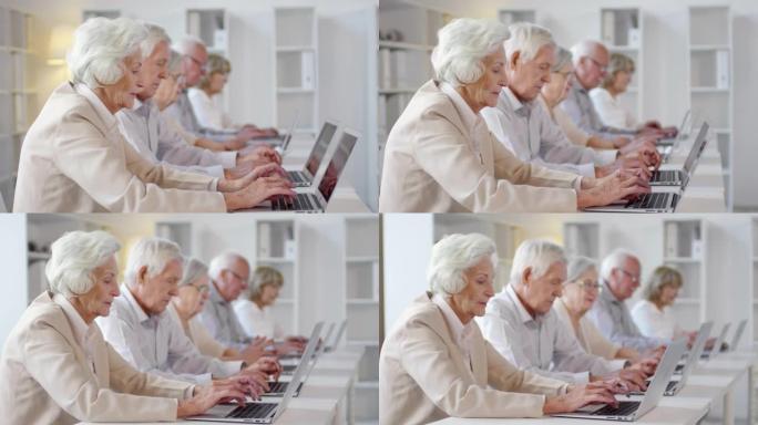 在计算机课上使用笔记本电脑的老年人群