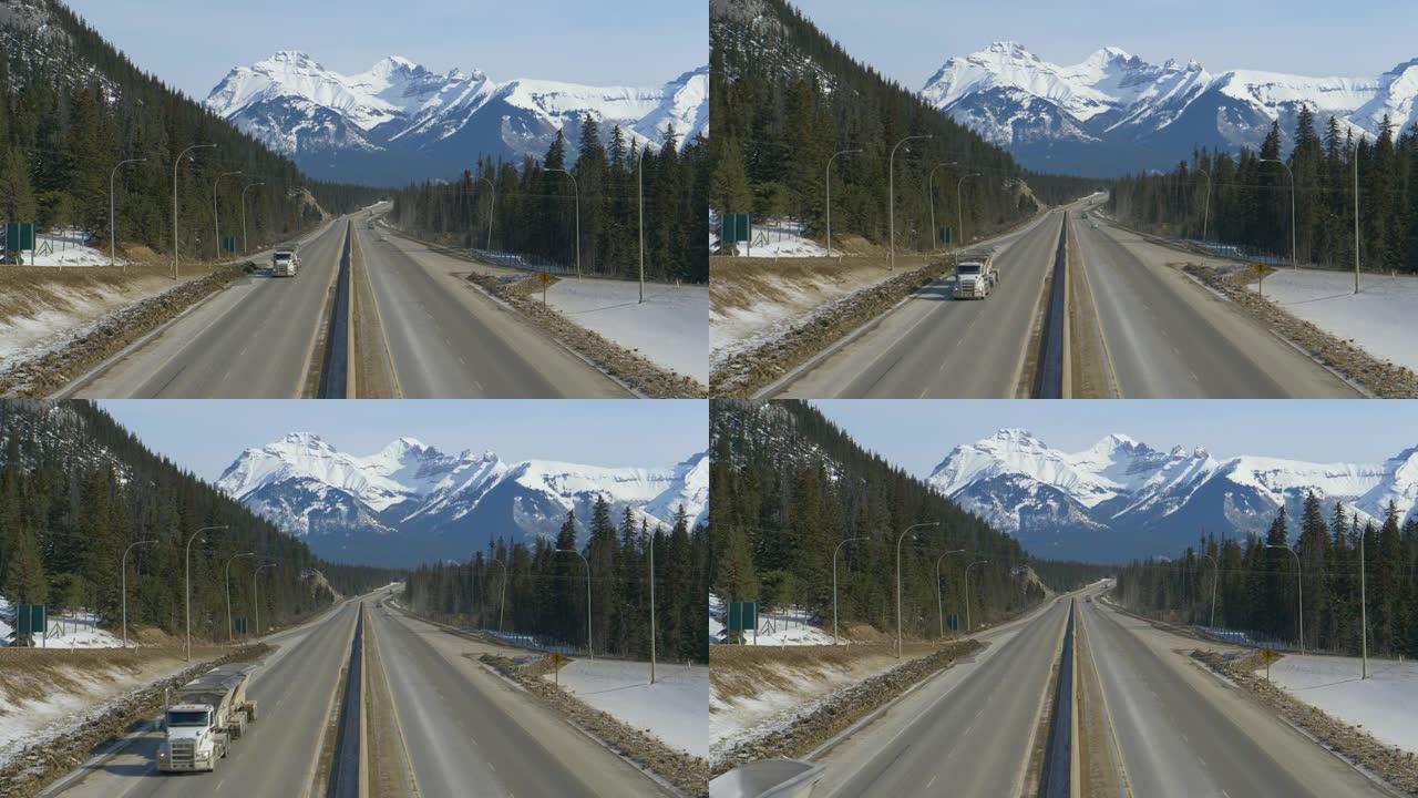 无人机: 当车辆驶过景观时，飞越加拿大横贯公路。