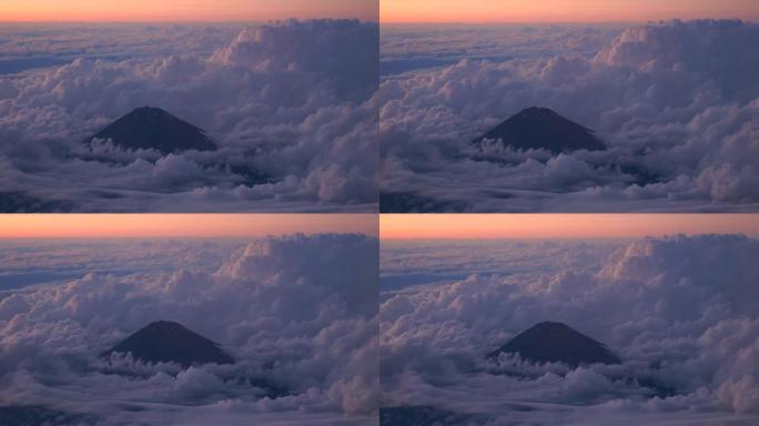 日落时云中富士山的鸟瞰图，4k