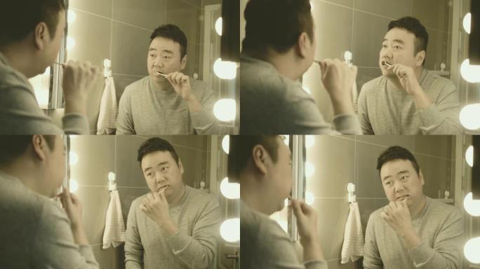 亚洲男子刷牙