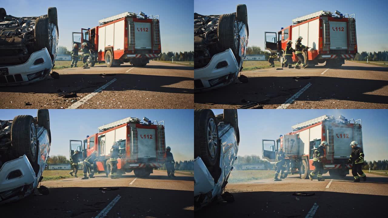 消防员救援队乘坐消防车抵达车祸现场。消防员从消防车上抢走他们的工具，设备和装备，急忙帮助受伤，被困人