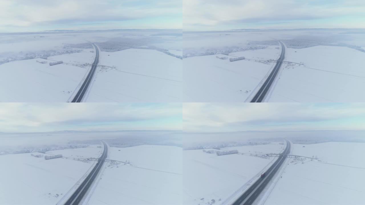WS鸟瞰图高速公路周围积雪覆盖的领域