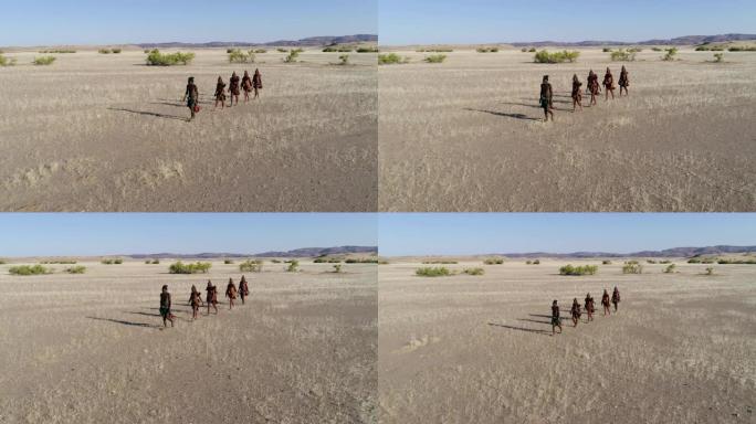 纳米比亚纳米比亚纳米布沙漠上的希姆巴部落人的4K空中平移镜头
