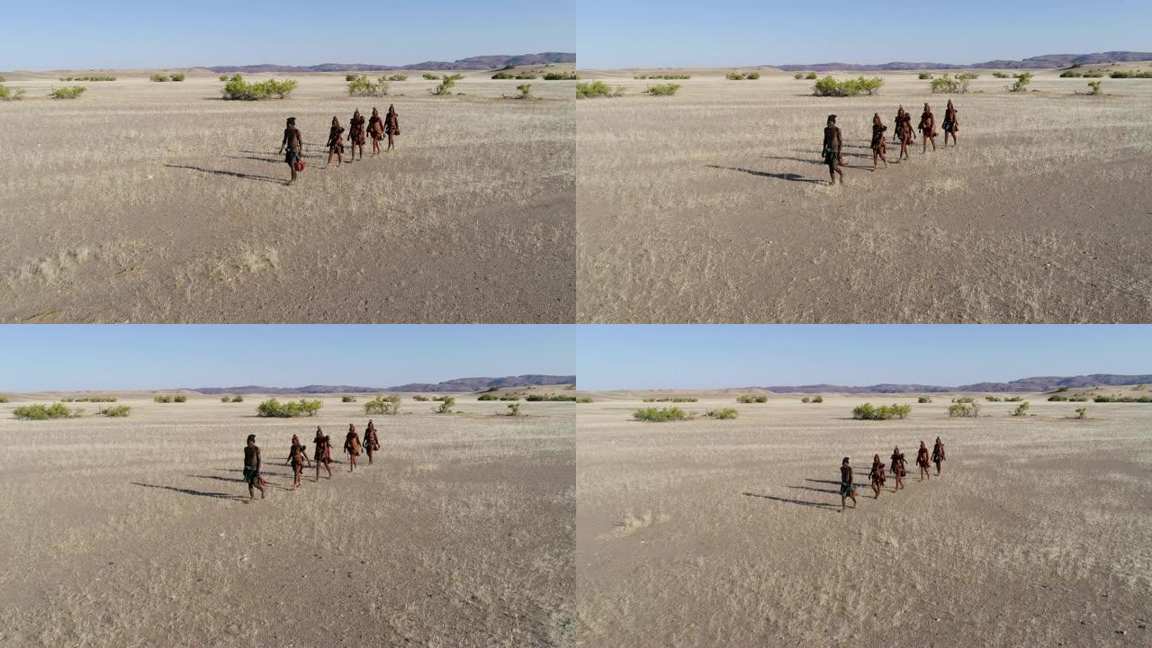纳米比亚纳米比亚纳米布沙漠上的希姆巴部落人的4K空中平移镜头