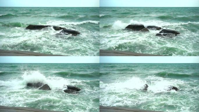 慢动作波撞击岩石大海边浪花海岛拍打石头礁