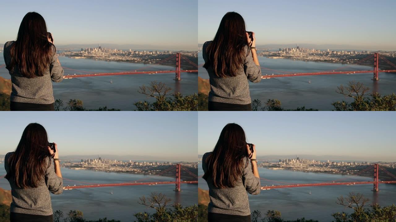 拍摄旧金山金门大桥的女人