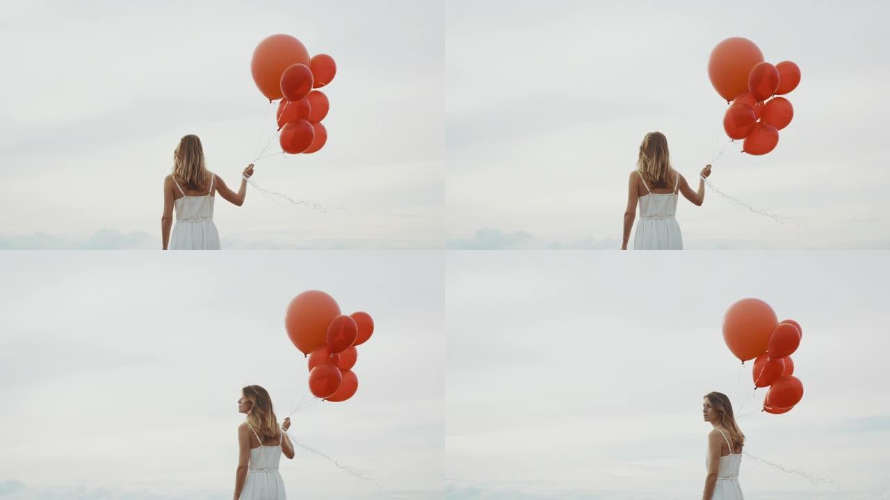 一个漂亮女人带着红色气球飘走