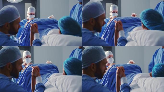 高加索女外科医生在医院手术室分娩时检查孕妇