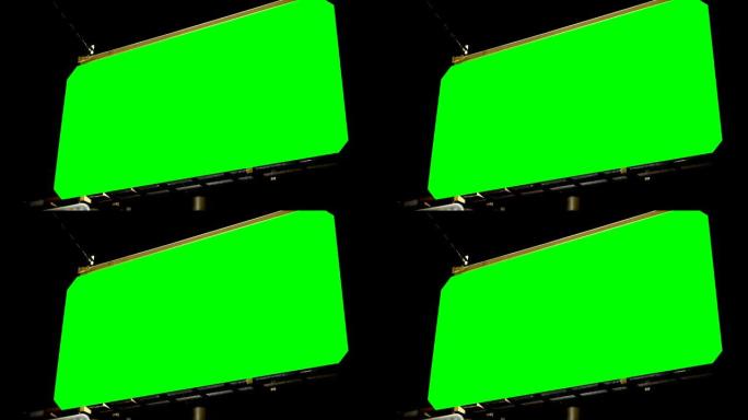 夜间4k，带色度键绿色屏幕的空广告牌的低角度视图