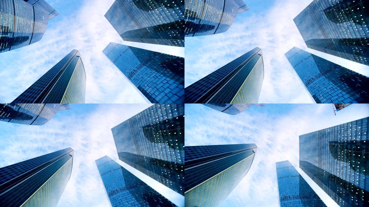 在蓝天背景下的几座摩天大楼的下行视图。