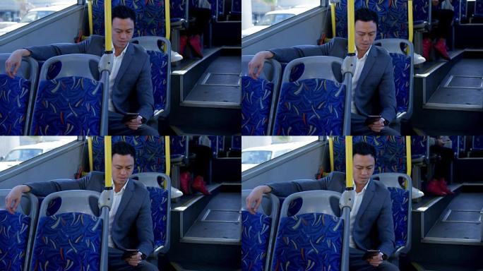 乘坐4k公交车时使用手机的商务通勤者