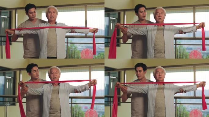 年轻的亚洲物理治疗师与老年患者一起工作