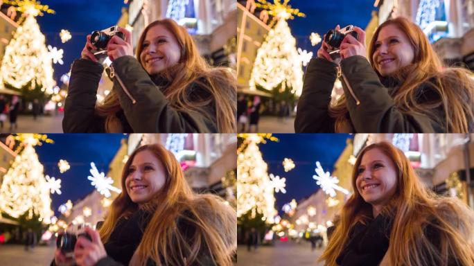 享受圣诞节假期，用模拟相机拍摄装饰精美的城市