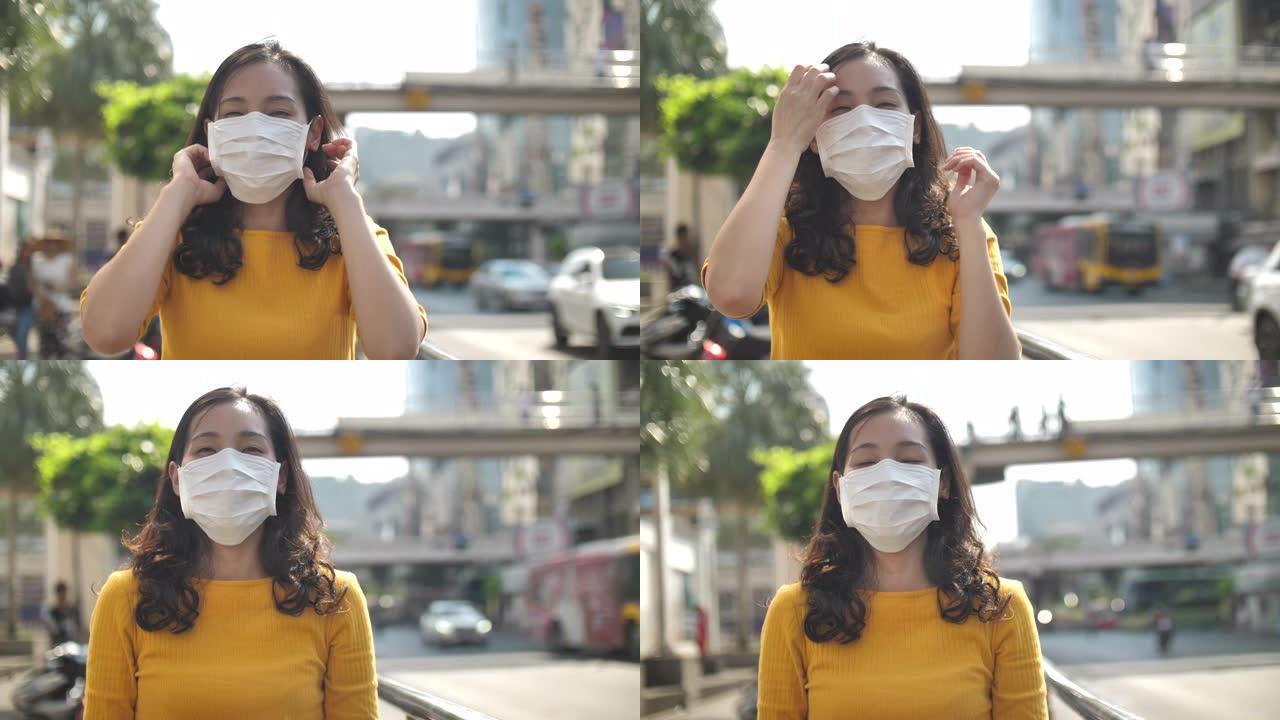曼谷空气污染妇女与面罩保护