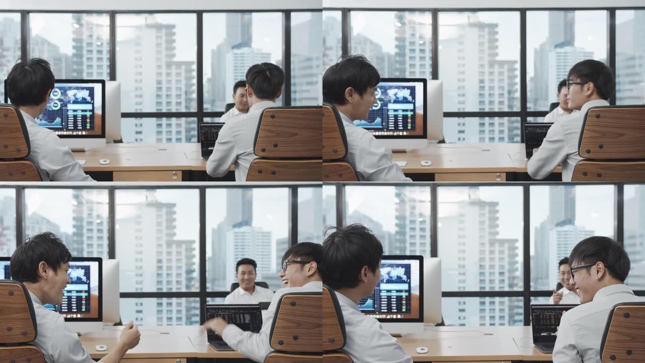 4K UHD: 两名亚洲商人在现代办公室感到快乐和手脚碰撞。