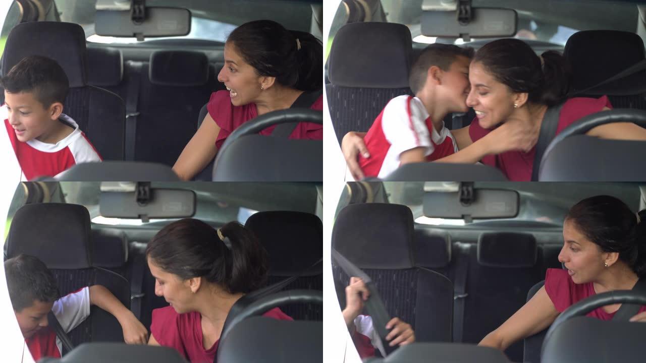 拉丁美洲妈妈在儿子上车时把他从足球练习中抱起来，并给妈妈击掌。