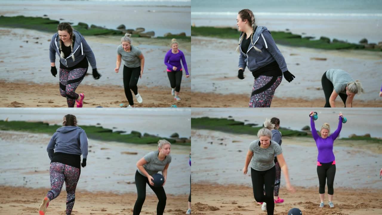 在海滩上享受训练营的妇女