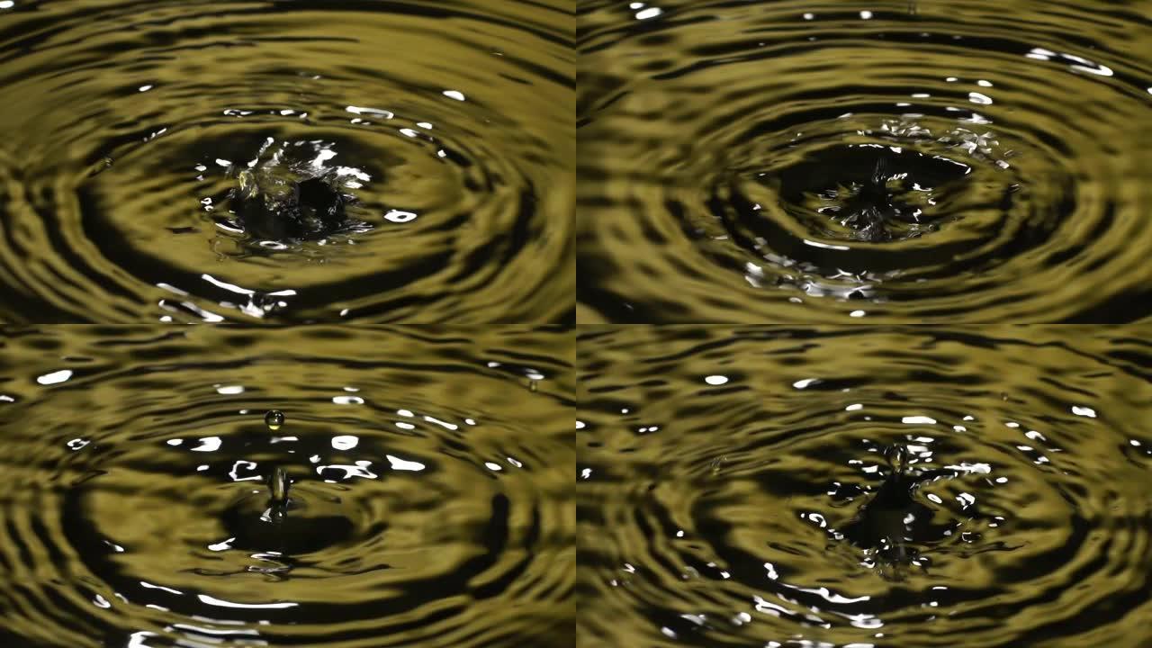 慢动作: 许多水滴变成黄色的水。