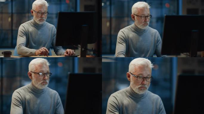 这位英俊而成功的中年大胡子商人在他的办公桌前使用笔记本电脑工作的肖像。对着镜头微笑。晚上在舒适的家庭